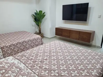 Cama o camas de una habitación en Sunset en Malecon de Mazatlan!