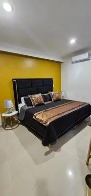 Cama o camas de una habitación en Torre 5 Mazatlán Versace Style