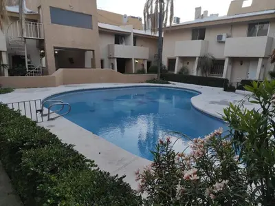 Piscina en o cerca de Quédate con Sandra en Departamento con alberca