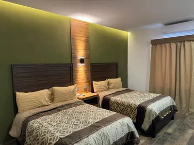 Cama o camas de una habitación en Hotel Los Valles Plus