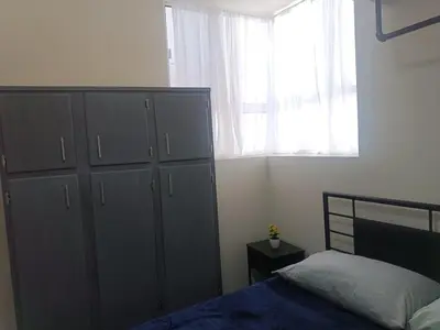 Cama o camas de una habitación en Apartment in Paseos de Chihuahua