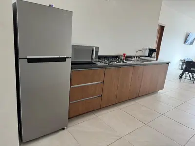 Una cocina o zona de cocina en Departamentos Aremay