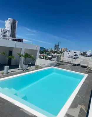 Piscina en o cerca de Departamento familiar