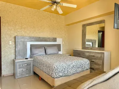 Cama o camas de una habitación en Beautiful beachfront space and pool