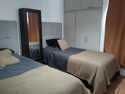 Cama o camas de una habitación en Casa linda y acogedora, a 3 min Distrito Uno