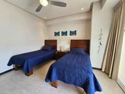 Cama o camas de una habitación en Oceanview Luxury Condo at Peninsula Mazatlán
