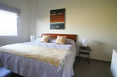 Cama o camas de una habitación en Stylish Home with Roof-Top Patio - Historic Centre