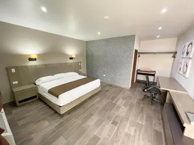 Cama o camas de una habitación en Palms Hotel