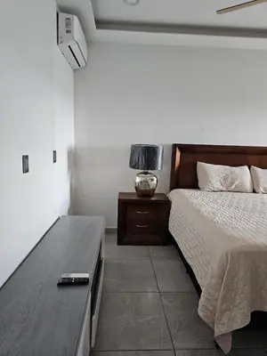 Cama o camas de una habitación en Departamento estilo Hotel