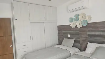 Cama o camas de una habitación en Mazatlan Executive Apartment