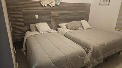 Cama o camas de una habitación en Mazatlan Executive Apartment