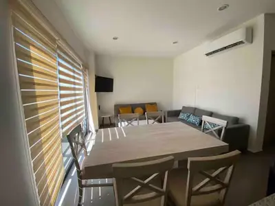 Una televisión o centro de entretenimiento en Departamento 2 Recámaras Torre Zúñiga Mazatlan