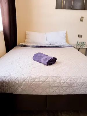 Cama o camas de una habitación en Cómoda y acogedora suite, Paseo Durango