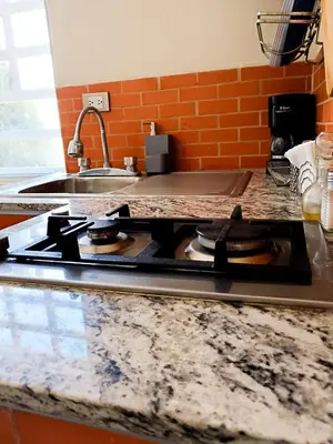 Una cocina o zona de cocina en Habitación arena, Paseo Durango