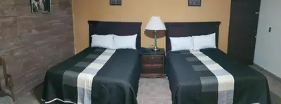 Cama o camas de una habitación en Hotel La Posta