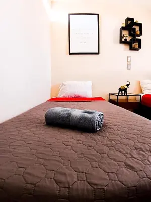 Cama o camas de una habitación en Golden Vintage Room , Paseo Durango
