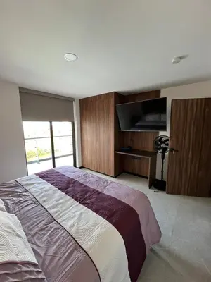 Cama o camas de una habitación en Departamento con alberca en Mazatlán