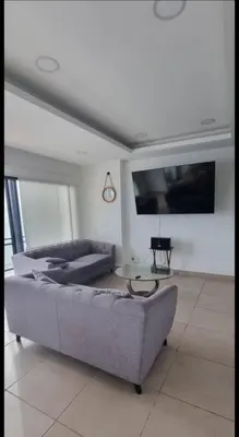 Cama o camas de una habitación en Lujoso departamento frente a la playa