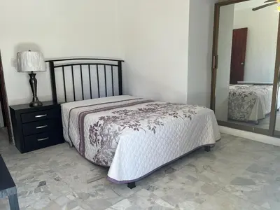 Cama o camas de una habitación en Departamento a metros de la playa