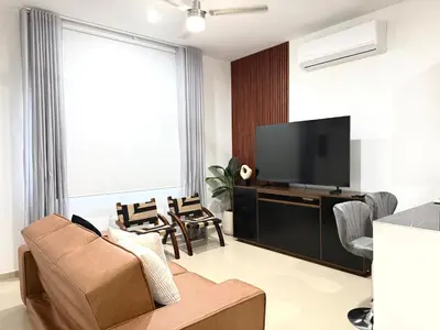 Una televisión o centro de entretenimiento en Encanto de Playa Sur By GEstores