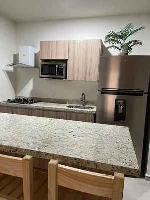 Una cocina o zona de cocina en Bluu Habitat Lagoons En Mazatlan DEPARTAMENTO