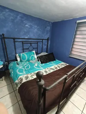 Cama o camas de una habitación en Full house terrace and grill