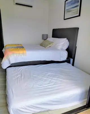 Cama o camas de una habitación en Marina Cerritos - Blanco Celeste - 5 Albercas