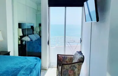 Cama o camas de una habitación en Miramar Depto de Lujo Frente Playa y Malecón