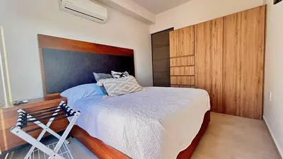 Cama o camas de una habitación en Condominio de Lujo con Laguna artificial y Hermosas Vistas