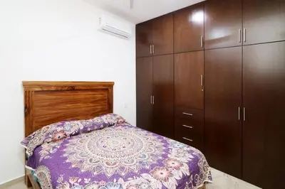 Cama o camas de una habitación en Apartamento reginas a unos pasos del malecón 4