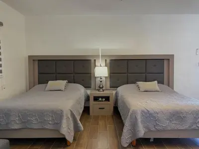 Cama o camas de una habitación en Hermosa Suite a pocas cuadras de la Playa
