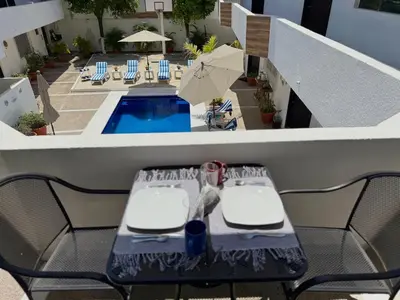Piscina en o cerca de Hermosa Suite a pocas cuadras de la Playa
