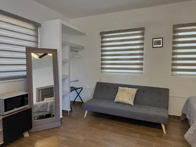 Zona de estar de Hermosa Suite a pocas cuadras de la Playa