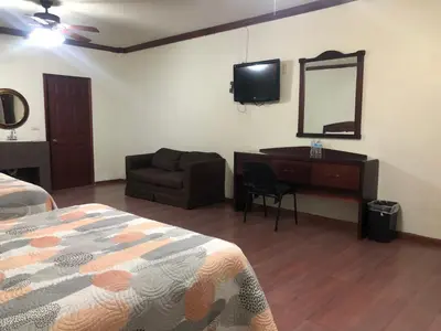 Cama o camas de una habitación en Hotel oasis suites
