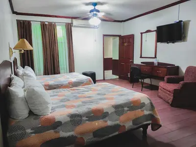 Cama o camas de una habitación en Hotel oasis suites