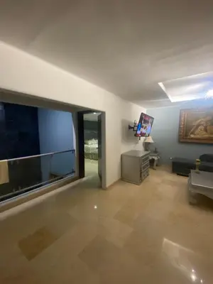 Una televisión o centro de entretenimiento en Casa azul particular