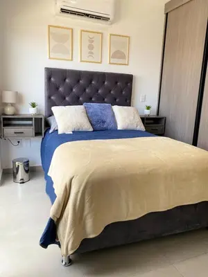 Cama o camas de una habitación en Departamento arcangel residencial