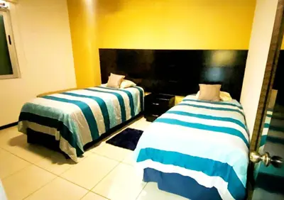 Cama o camas de una habitación en Horizon #2 Esmeralda de Lujo Frente Playa y Malecón