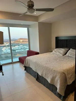 Cama o camas de una habitación en Beachfront Apartment