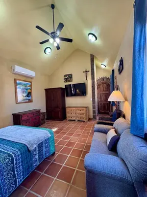Una televisión o centro de entretenimiento en Suite Atún - Justo Centro y a Pasos de la Playa