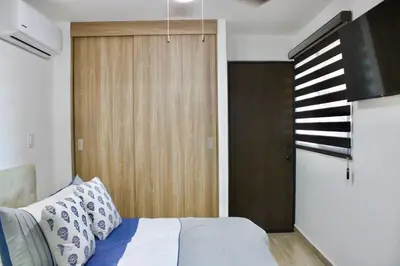 Cama o camas de una habitación en Hermoso departamento con vista al mar