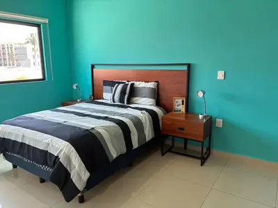 Cama o camas de una habitación en Alojamiento A Unas Calles del Malecon