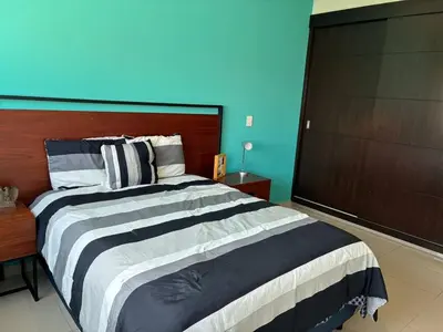 Cama o camas de una habitación en Alojamiento A Unas Calles del Malecon