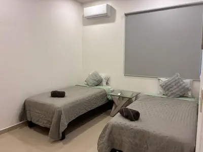 Cama o camas de una habitación en Departamento a unas Calles de la Zona Dorada