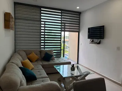 Una televisión o centro de entretenimiento en Departamento a unas Calles de la Zona Dorada