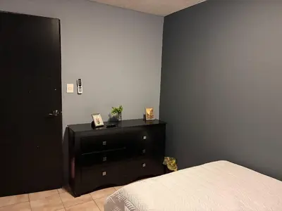 Cama o camas de una habitación en Depa en el Corazon de la Zona Dorada Y Playa