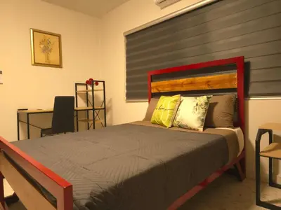 Cama o camas de una habitación en OLYMPIA SUITES sleep local habitaciones ejecutivas