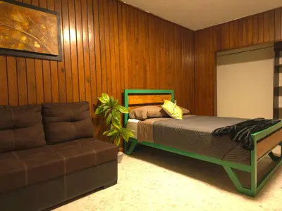 Cama o camas de una habitación en OLYMPIA SUITES sleep local habitaciones ejecutivas