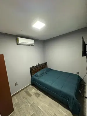 Cama o camas de una habitación en Depa nuevo y equipado en Saltillo 2 recámaras