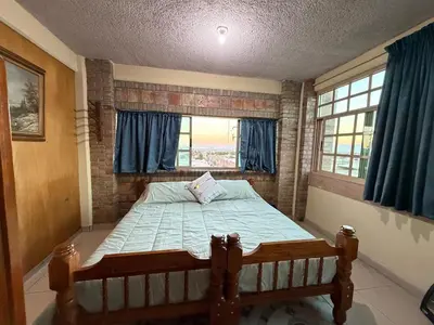 Cama o camas de una habitación en Departamento Nuevo Céntrico con vista hacia la catedral